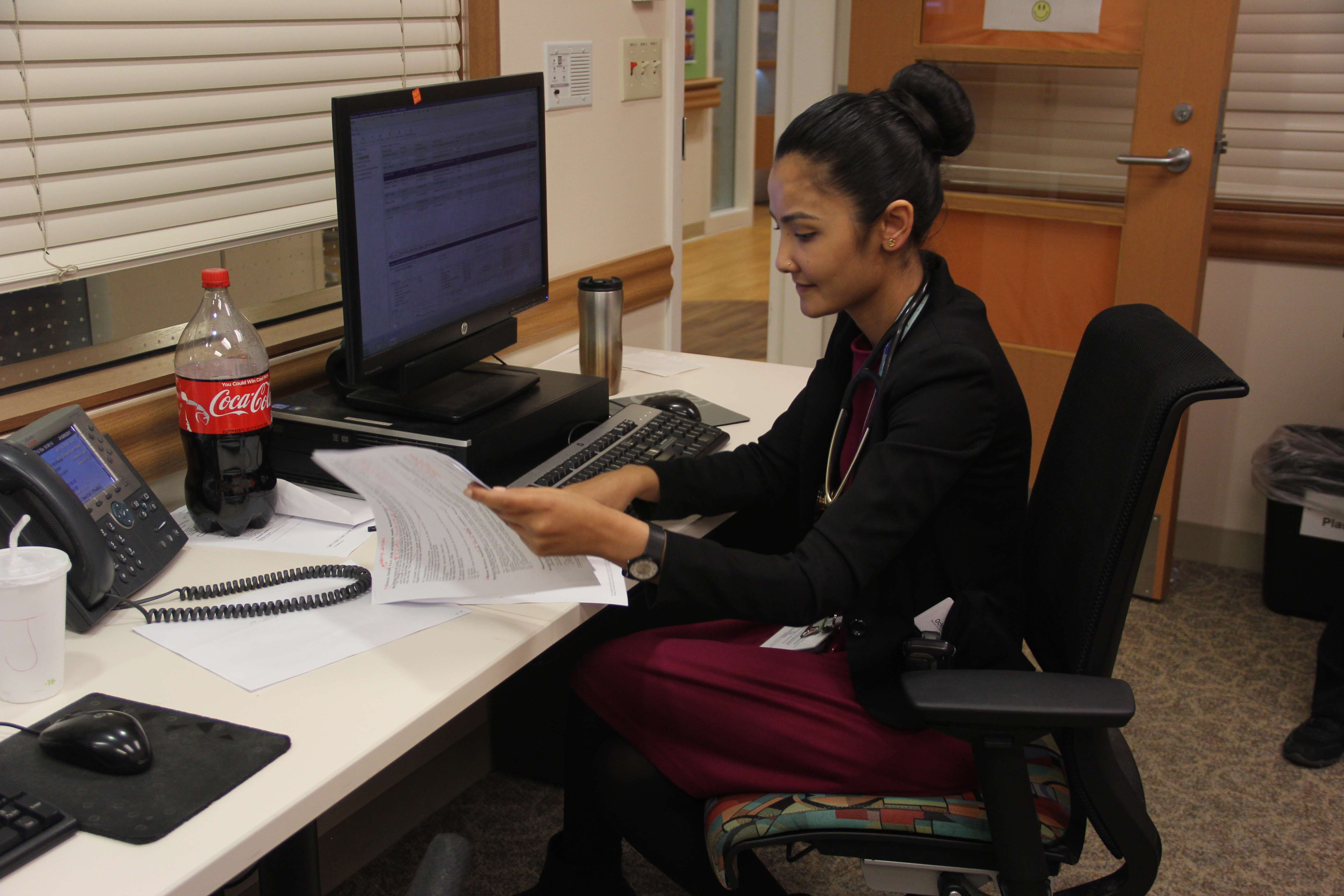 woman sitting at computer desk