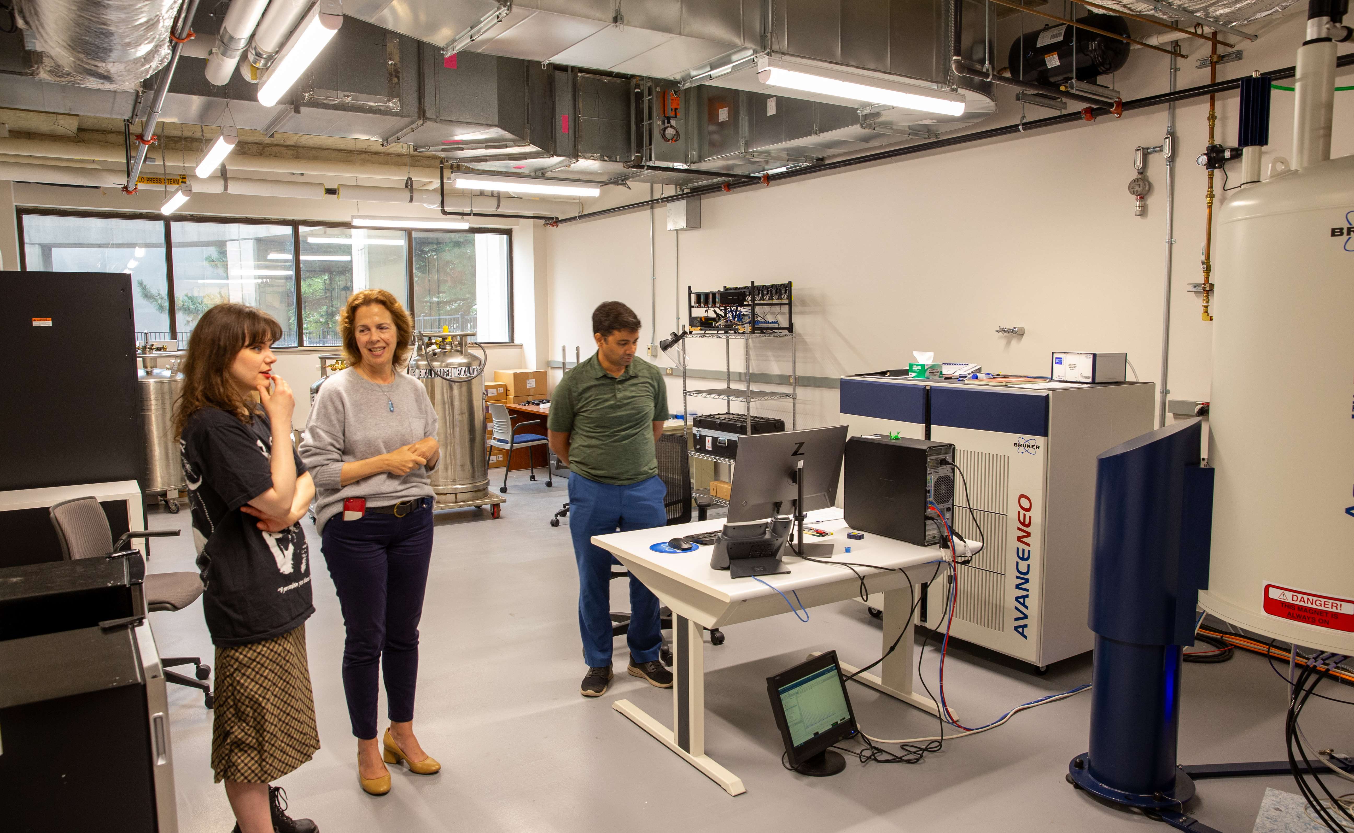 Amanda, Dr Marassi, and Dr Tata viewing nuclear magnetic resonance (NMR) equipment in the Biophysics department at MCW.