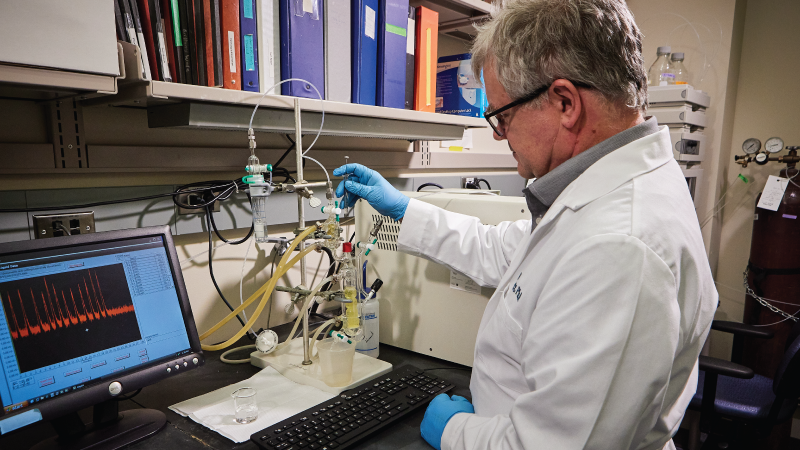 a professor performing an experiment