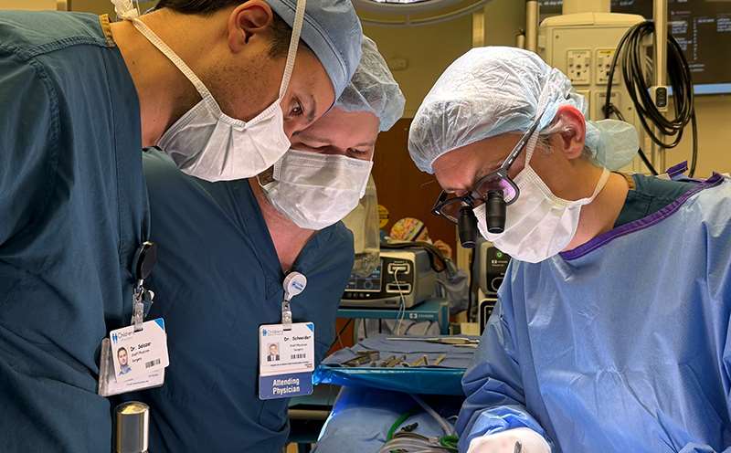 Three surgeons in operating room