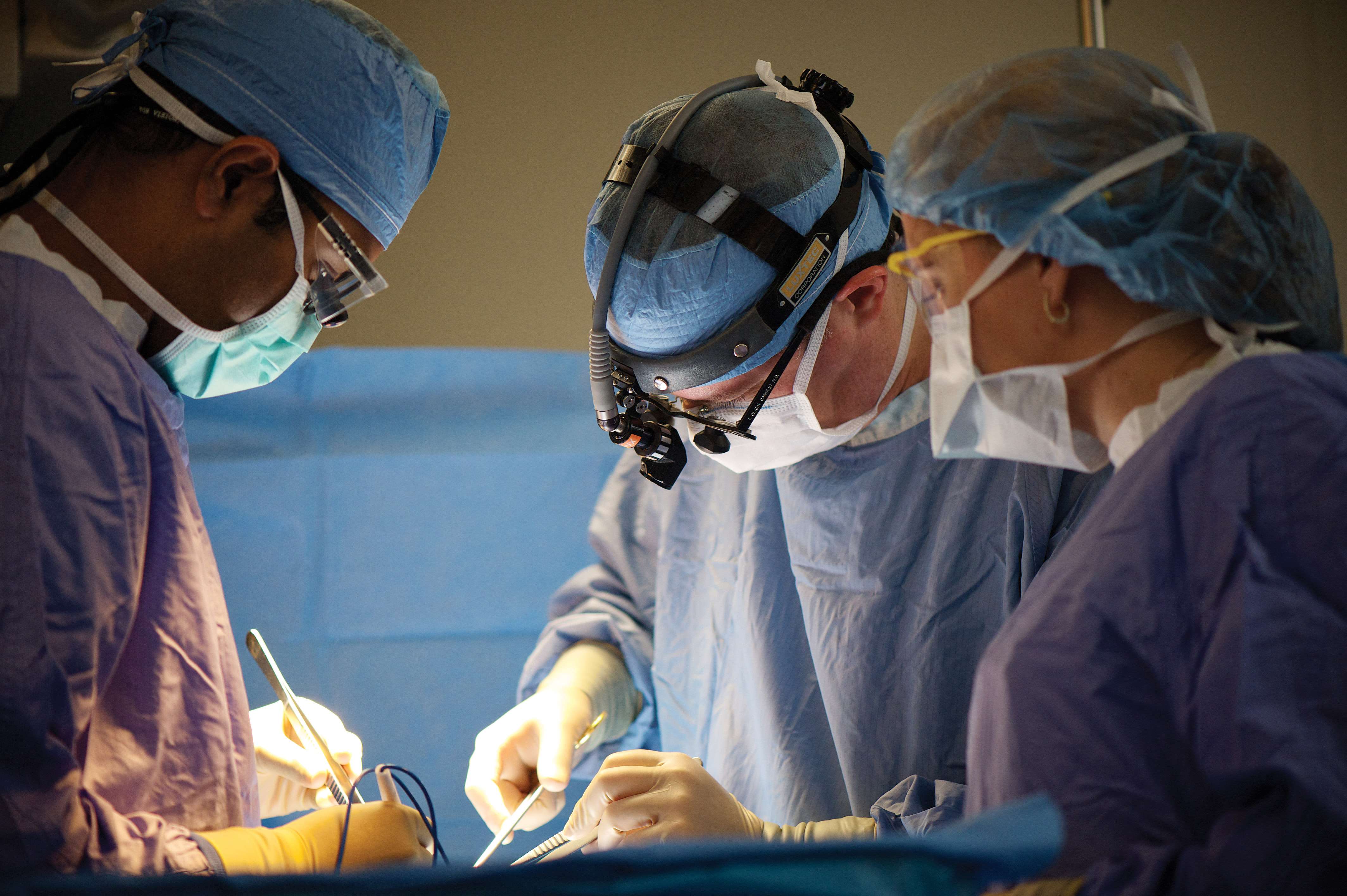 surgeons performing surgery