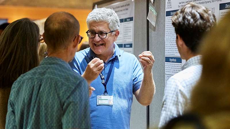 People presenting at a poster conference