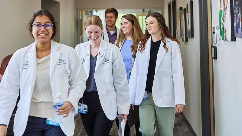Medical students walking in hallway