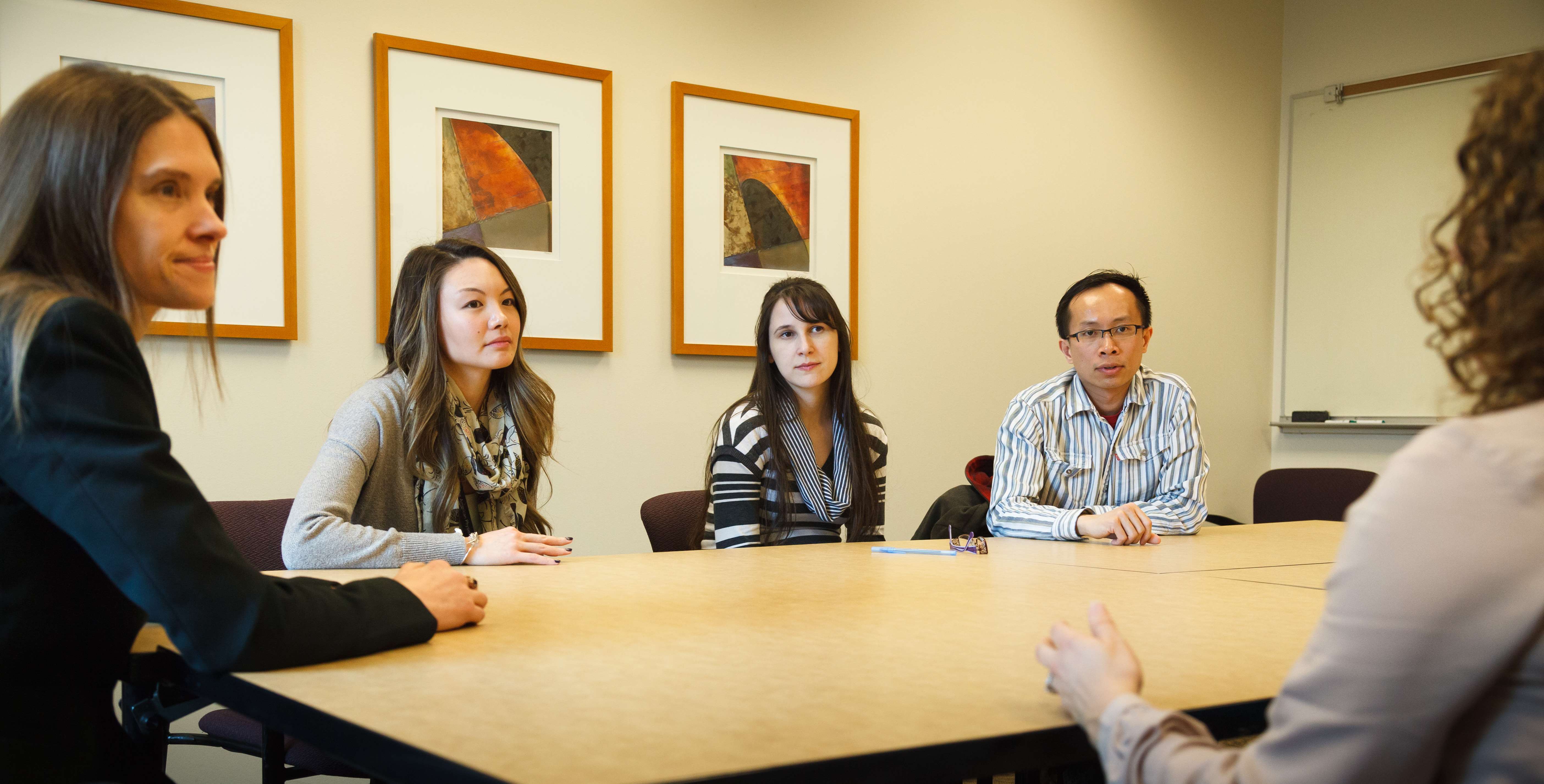 People sitting at conference table