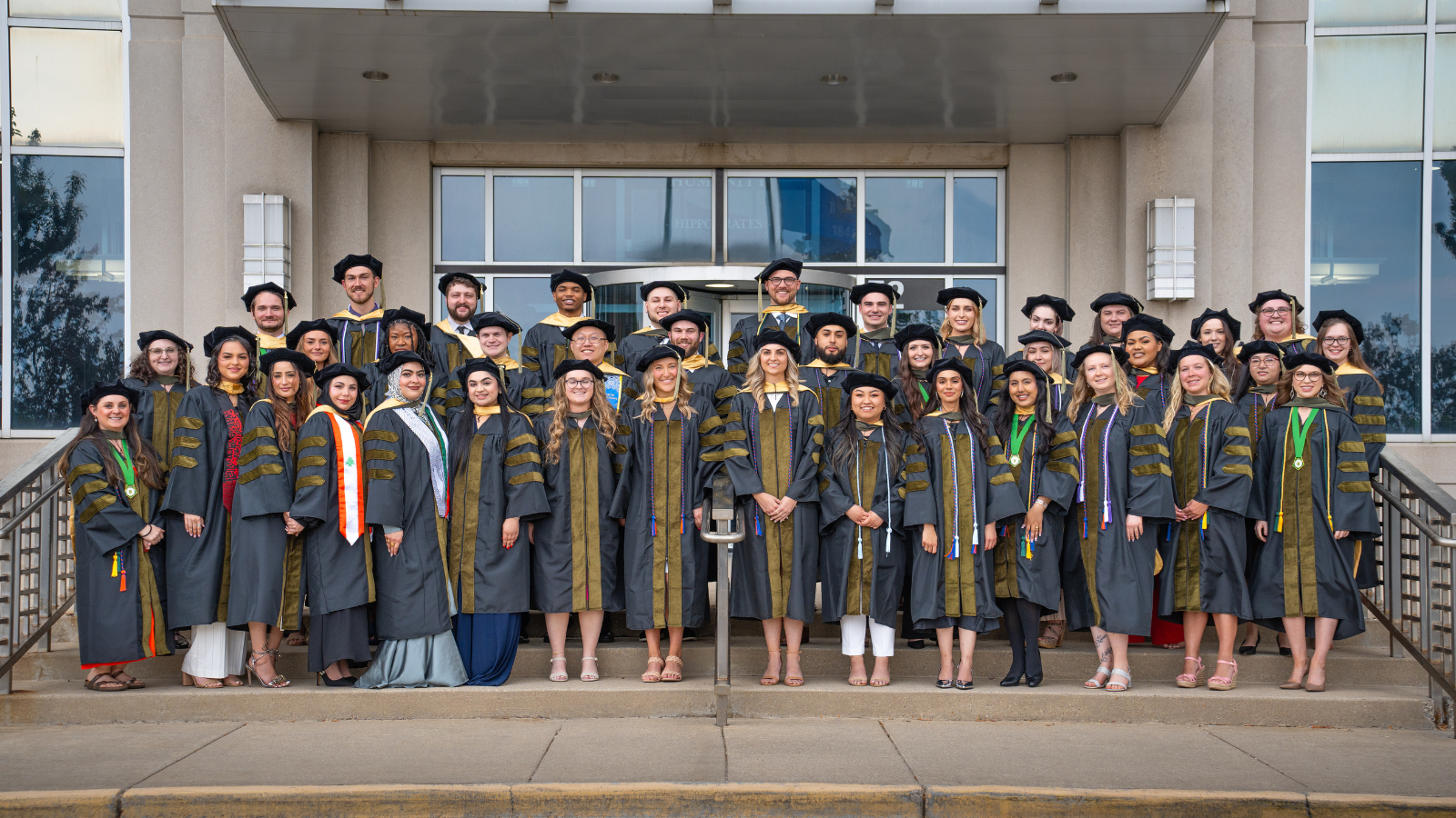 2024 PharmD Class_Intro Component Group photo of the Doctor of Pharmacy Class of 2024 in graduation attire on the Medical College of Wisconsin steps.