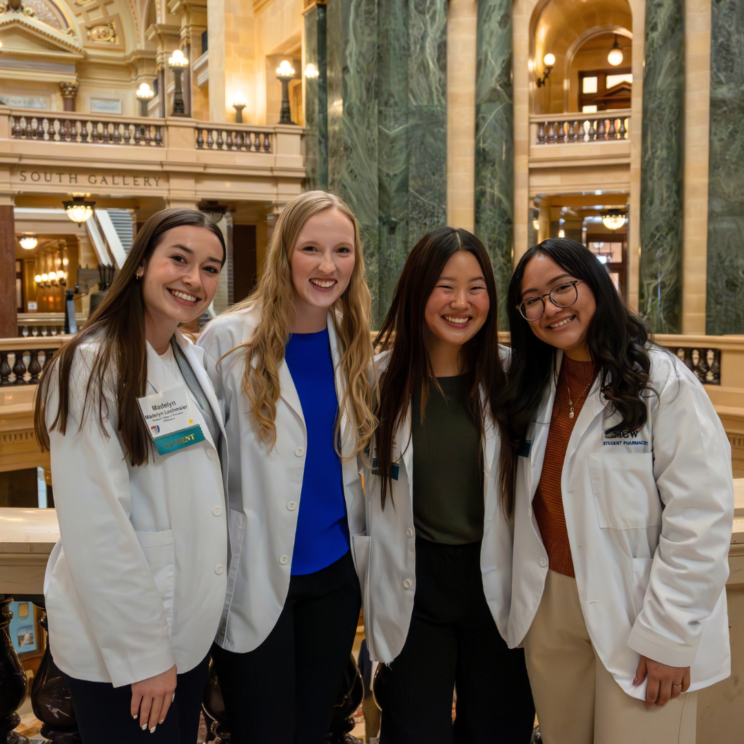 Four female pharmacy students in the Wisconsin Capitol building, advocating for the pharmacy profession.
