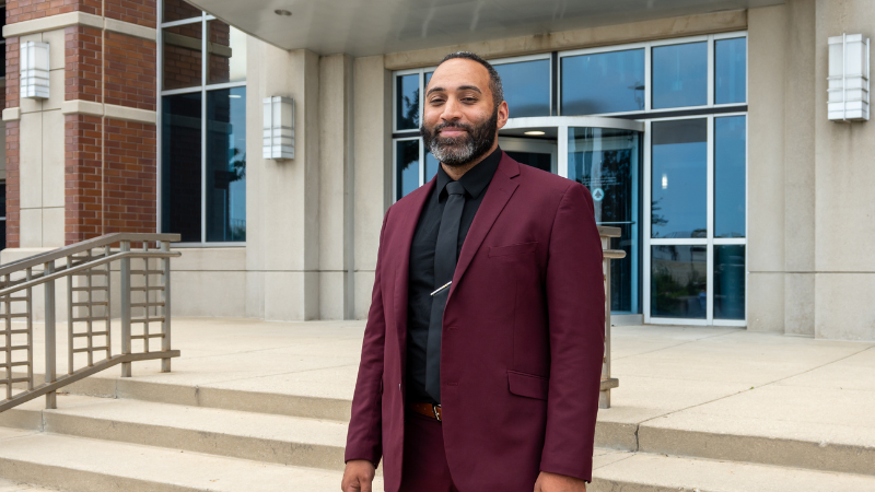 Erik Everton_Testimonial Erik Everton, PharmD, alumnus of the MCW School of Pharmacy, pictured outside of the school's entrance.