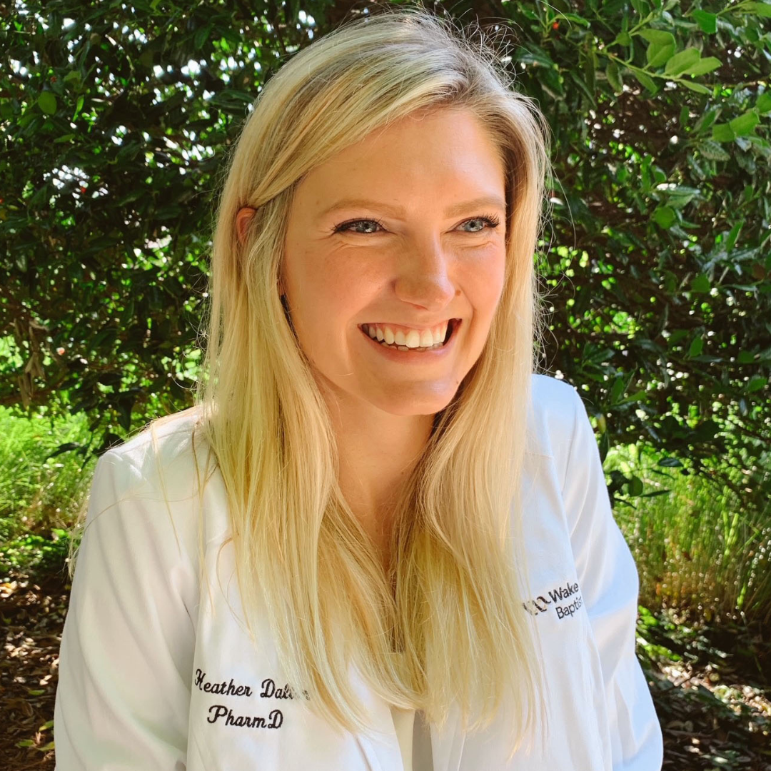 Heather Dalton, PharmD, MS Girl in a white coat, smiling.