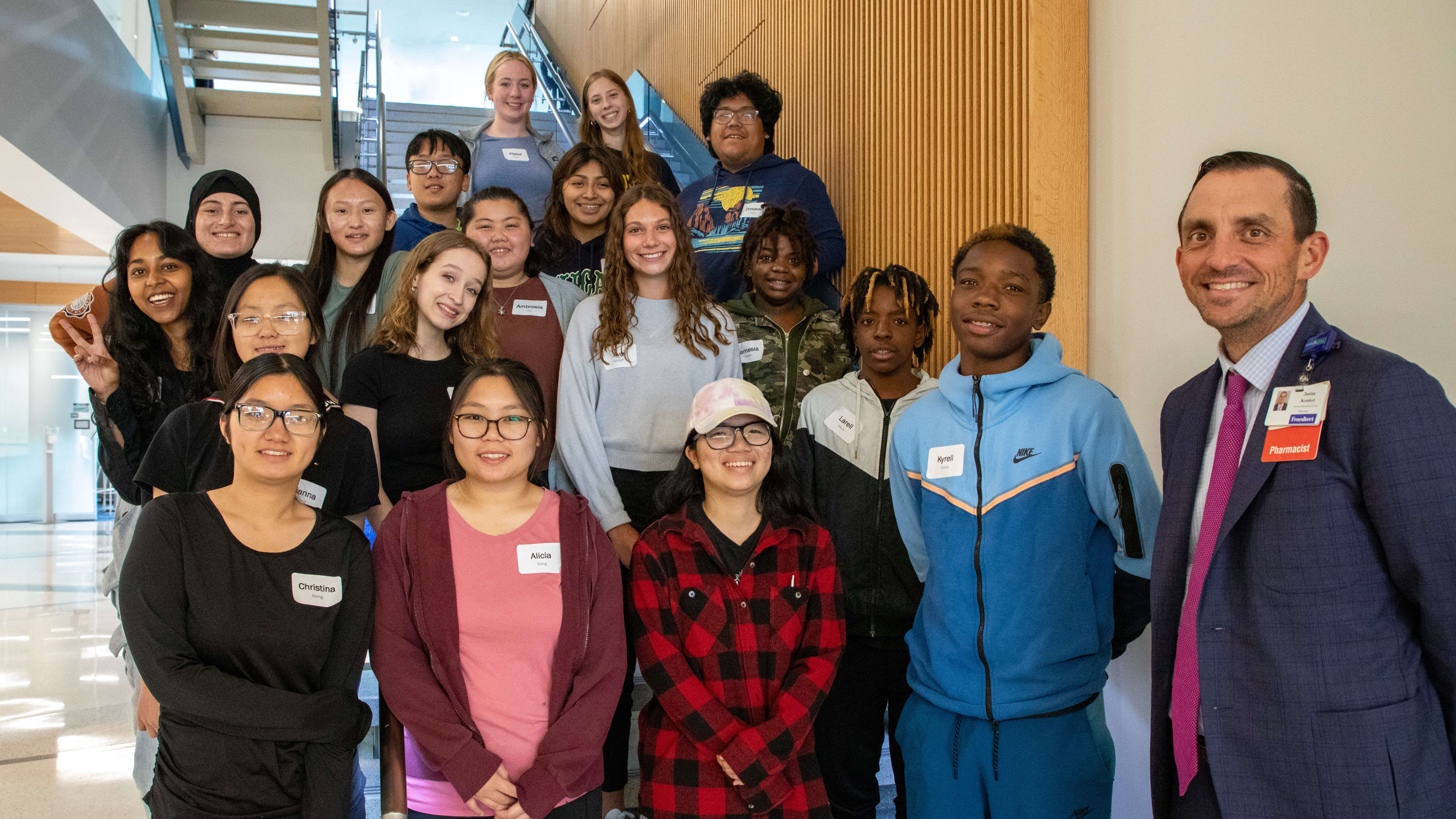 Pre-Pharmacy Scholars_Image Text Split Pre-Pharmacy Scholars group photo standing on a staircase at the Medical College of Wisconsin.