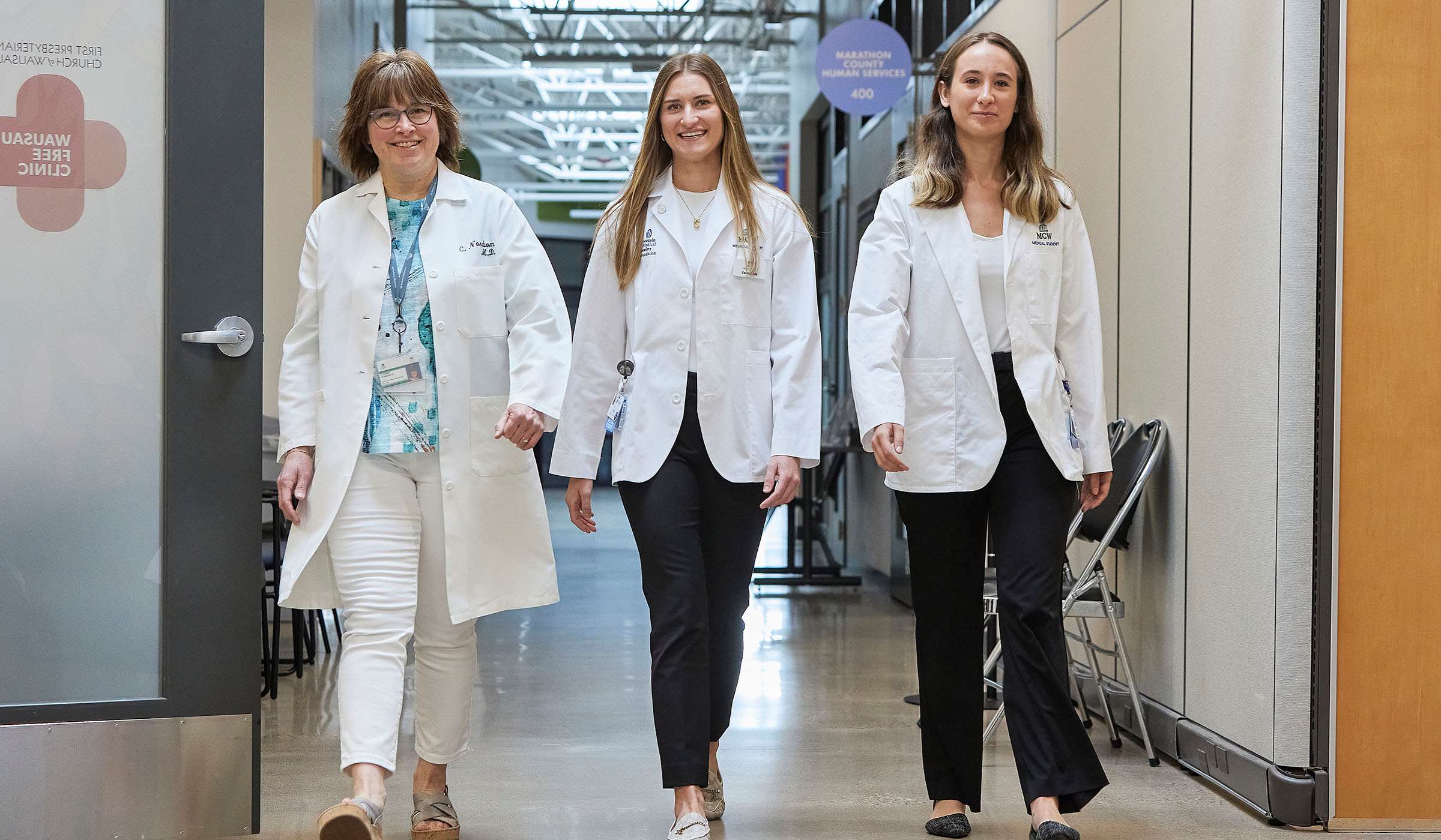 MCW-Central Wisconsin students and faculty walking in hallway