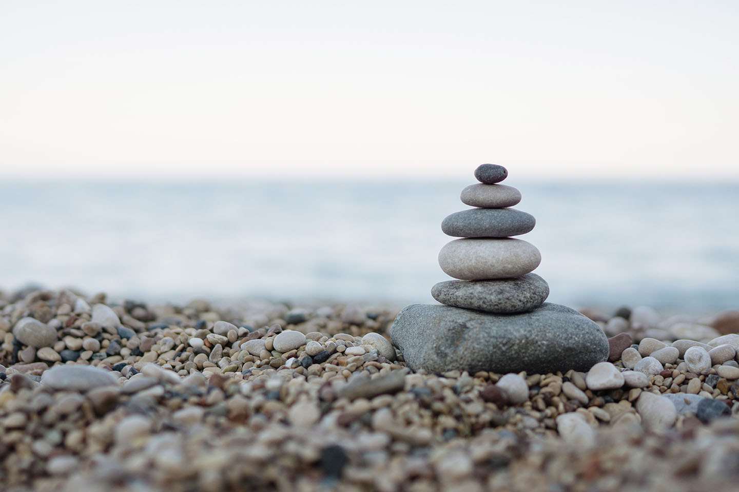 Pebbles stacked on shore