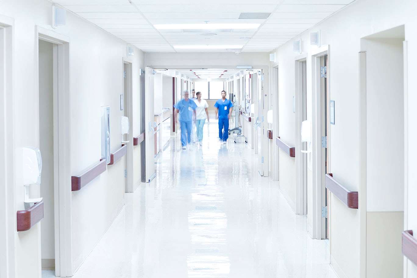 Care team in hallway from distance