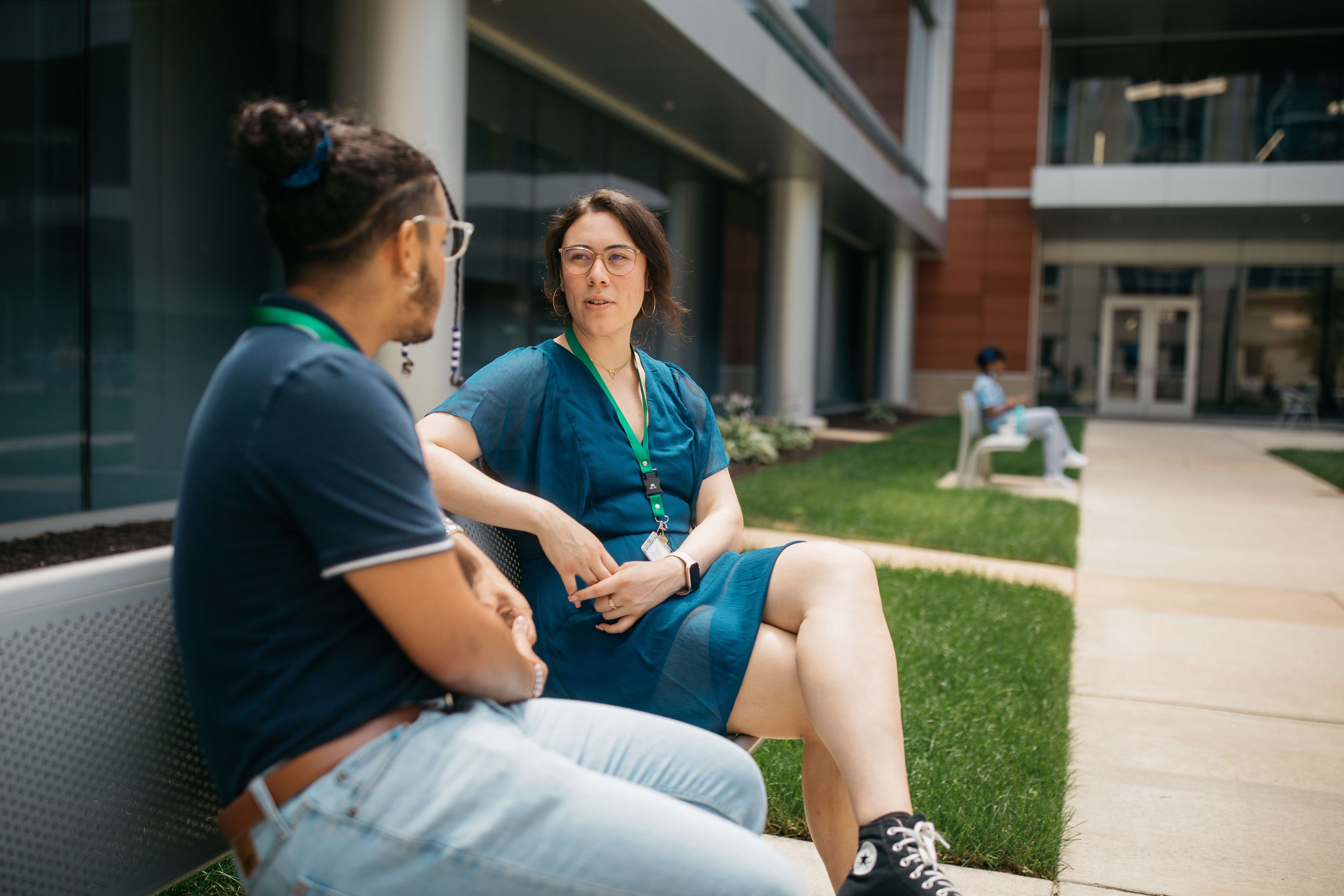 two people sitting on bench