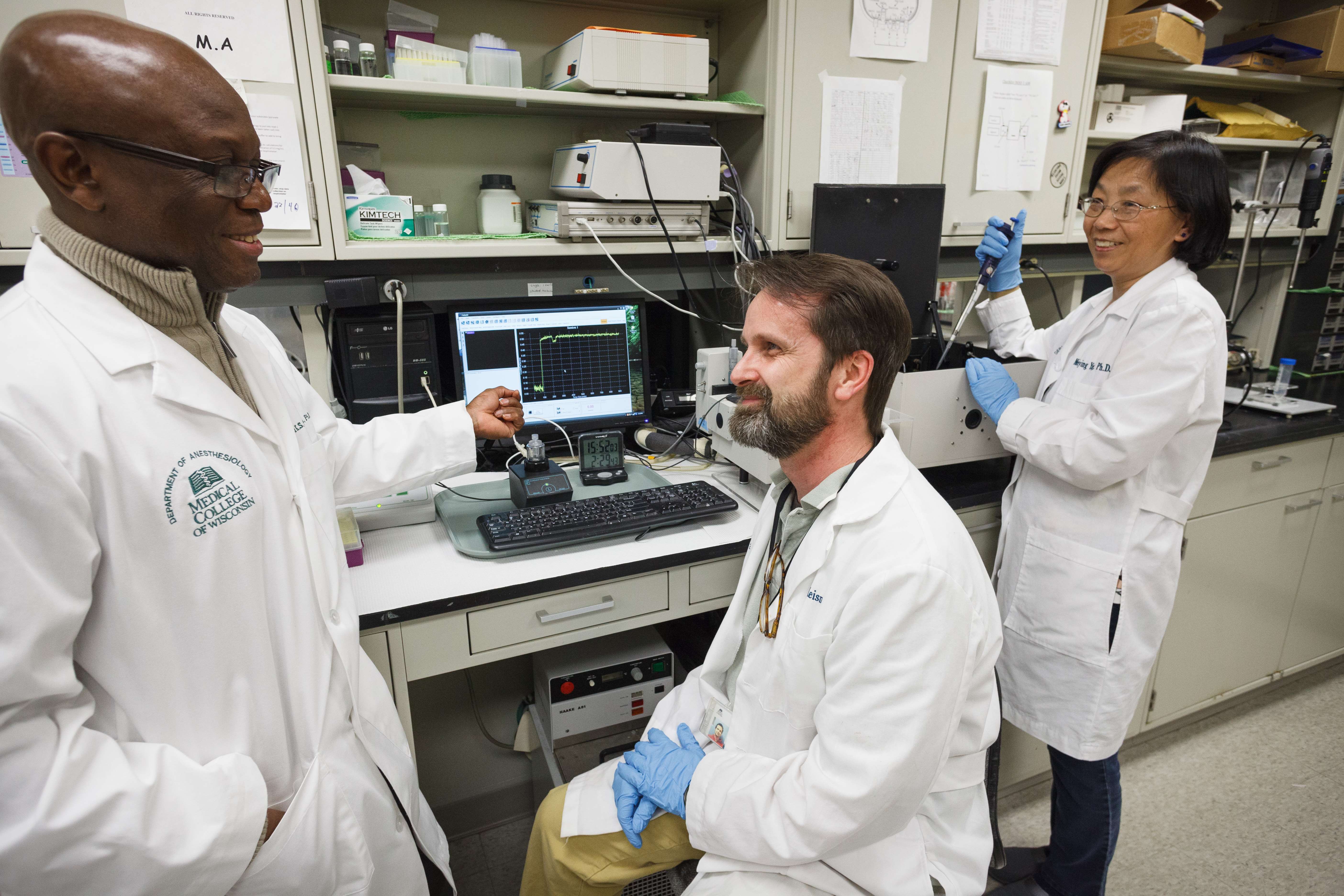 Four researchers in the lab