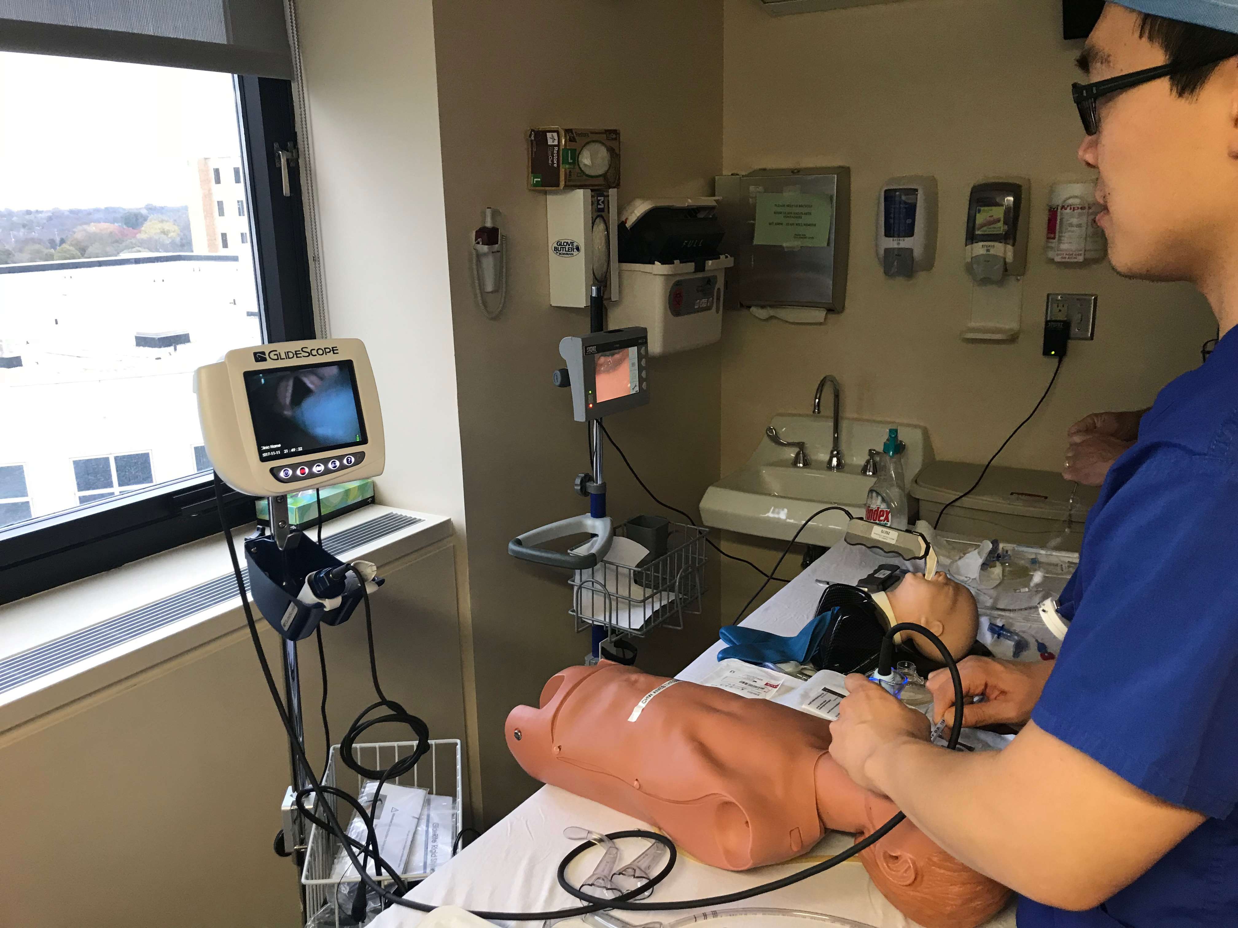 Pediatric trainee performing an endoscopy on a mannequin