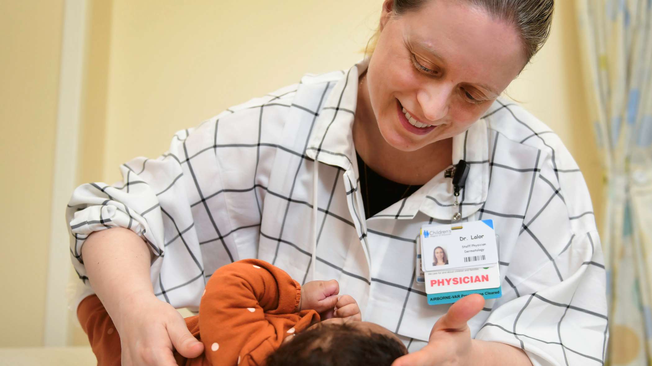 A doctor examining a baby