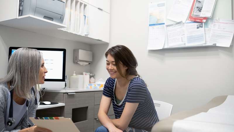 Physician and Patient in Exam Room